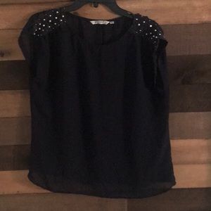 Adorable sheer blouse with pearl accents!